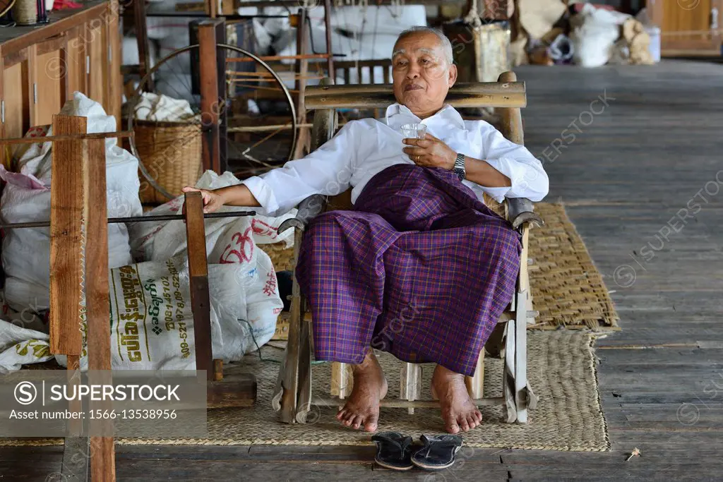 Myanmar, Shan State, Inle Lake, In Phaw Khone village, The chairman of Ko Than Hlaing weaving factory.