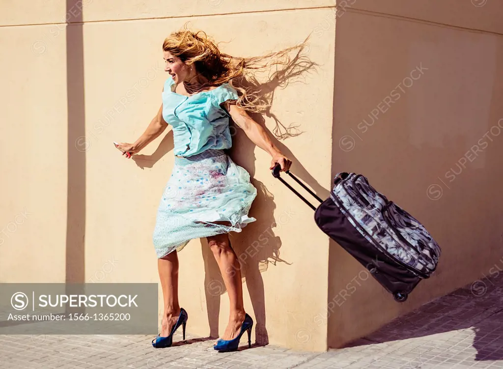 Woman on a windy street.