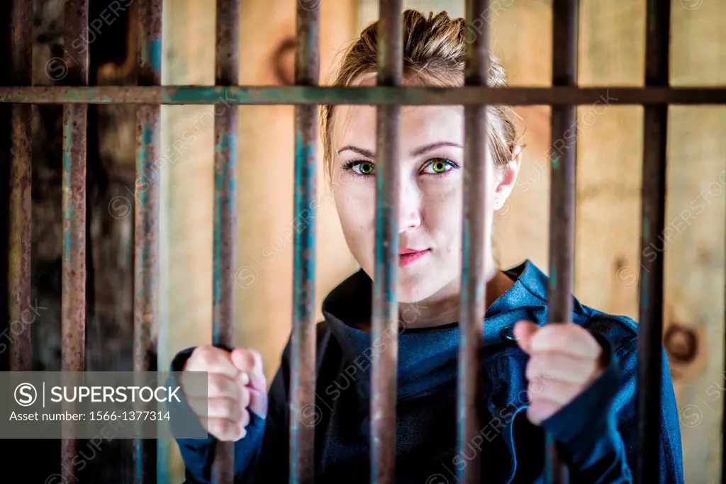 Woman behind bars.