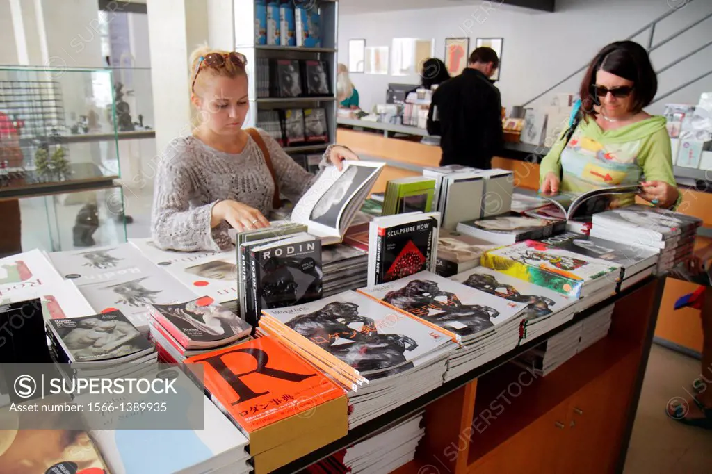 France, Europe, French, Paris, 7th arrondissement, Musée Rodin, Rodin Museum, gift shop, art, shopping, sale, books, woman, browsing,.