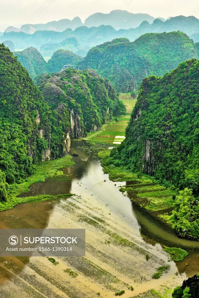 beautiful limestone karst mountains over the Tam Coc River in Ninh Binh, Vietnam.