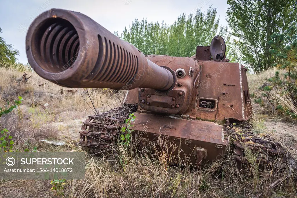 Abandoned ISU-152 Soviet self-propelled gun near Chernobyl Nuclear Power Plant in Zone of Alienation around the nuclear reactor disaster in Ukraine.