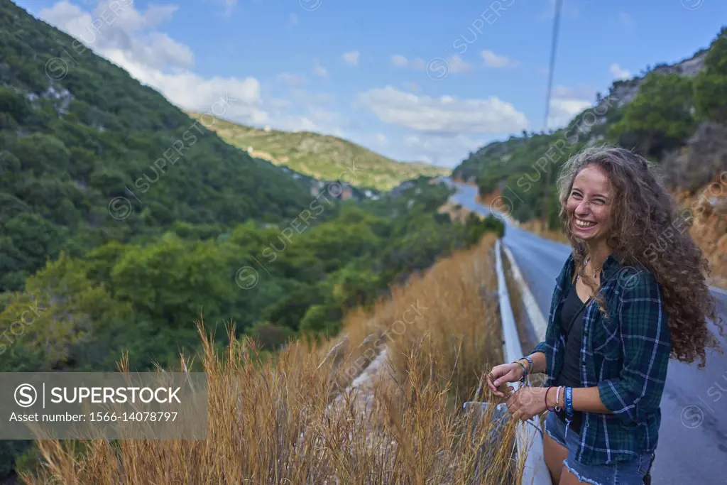 British girl enjoying nature during travel adventure in Crete, Greece