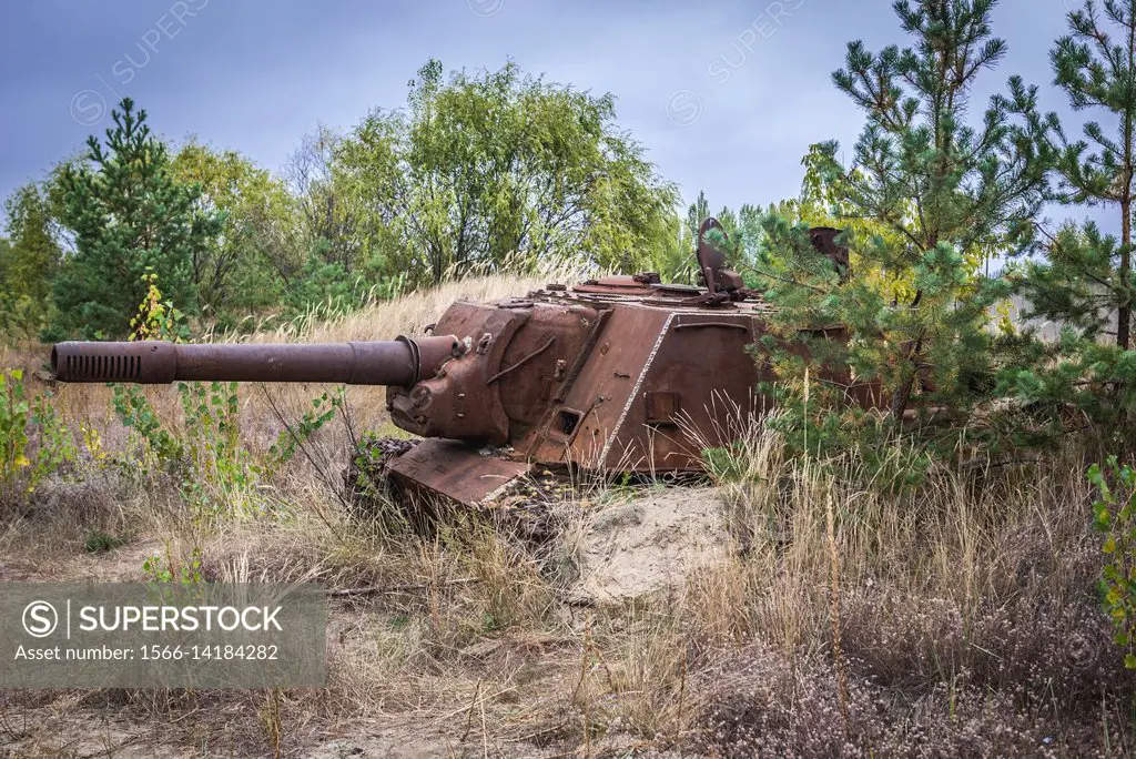 Abandoned ISU-152 Soviet self-propelled gun near Chernobyl Nuclear Power Plant in Zone of Alienation around the nuclear reactor disaster in Ukraine.