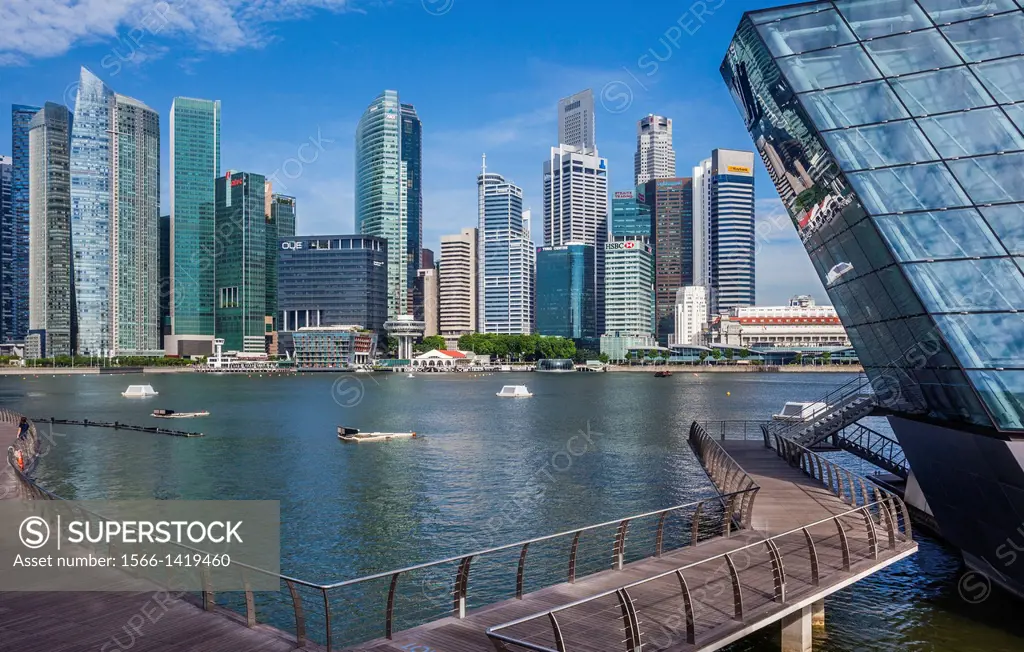 Singapore, view of the financial district from Marina Bay Sands waterfront boardwalk with Crystal Pavilion North.