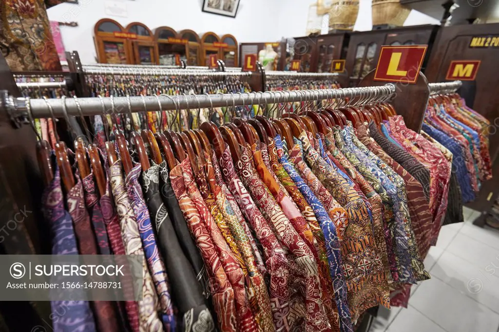 Colorful silk batik shirts on a rack in Hamzah Batik shop. Yogyakarta, Java, Indonesia.