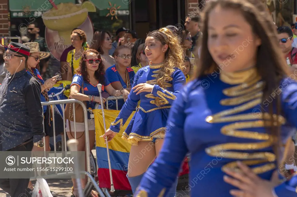 Spectators watch the 9th Annual Flower Parade (Desfile de las Flores) in the Jackson Heights neighborhood of Queens in New York on Sunday, July 8, 201...