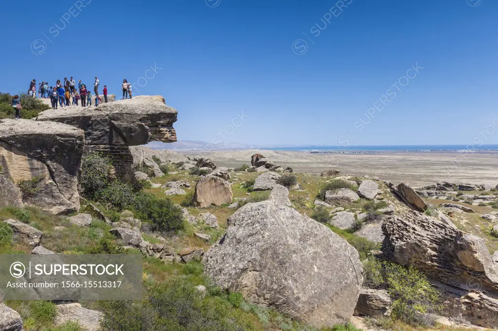 Azerbaijan, Qobustan, Qobustan Petroglyph Reserve, Petroglyph Trail with people, NR.