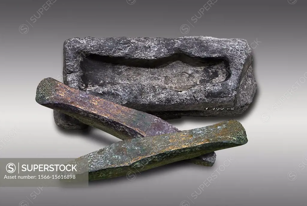 Hittite axe head mould and bronze axe heads. Hittite Period 1600 - 1200 BC. Alaca Hoyuk. Çorum Archaeological Museum, Corum, Turkey.