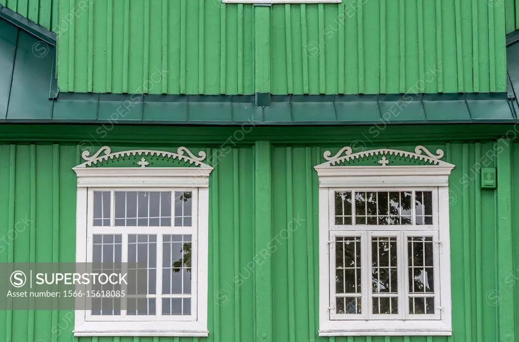 Exterior of green Russian Orthodox Church (Cerkiew Šw. Michala Archaniola w Trzesciance) in the ´Land of the Open Shutters´ with two windows, Trzesci...