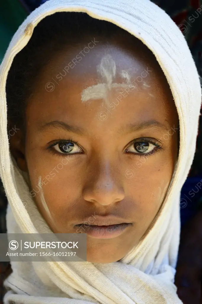 Ethiopia, Gonder, World Heritage Site, Debre Berhan Selassie church, Holy Trinity mass, Young devotee.