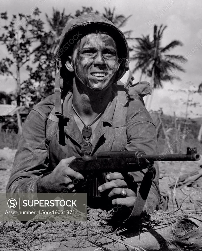 PACIFIC OCEAN Guam -- Jul 1944 -- a US Marine awaits signal to go ahead in battle to recapture Guam from Japanese -- Picture by Paul Dorsey / Lightroo...