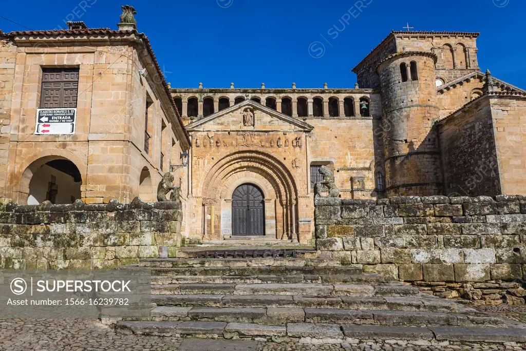 Front view of Romanesque collegiate church and cloister of Santa Juliana in Santillana del Mar historic town located in Cantabria region of Spain.