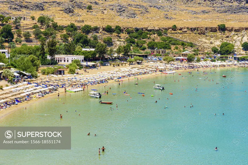 Popular shallow waters of Lindos Town beach, Lindos, Rhodes, Greece.