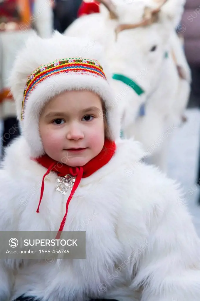 Sami (Lapp) girl in traditional clothes at Winter Fair. Jokkmokk, Northern Sweden