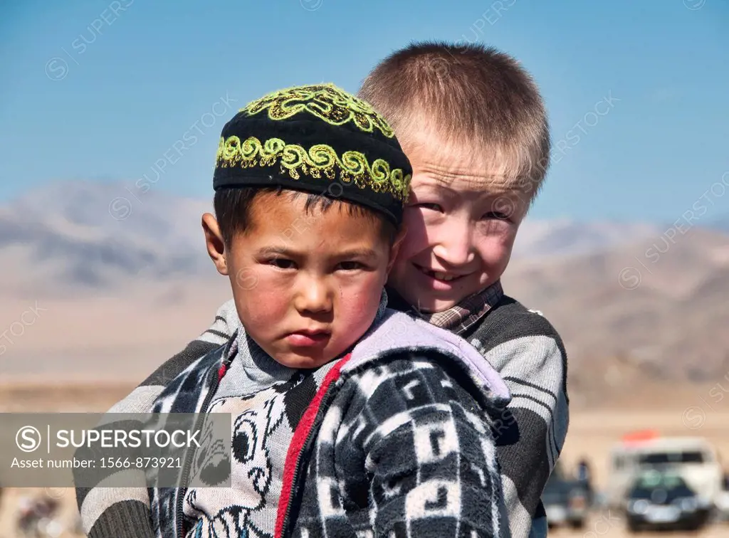 portrait of two Kazakh boys in the Altai Region of Bayan-Ölgii in Western Mongolia