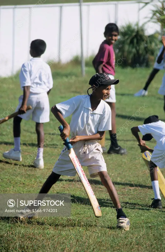 Young teenagers boys playing cricket, Galle, Sri Lanka