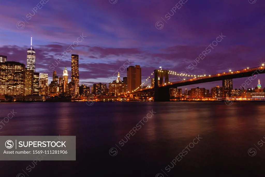 Manhattan skyline and Brooklyn Bridge at dusk