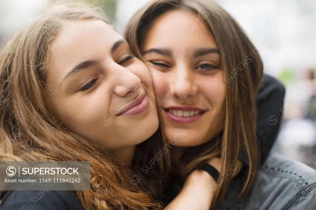 Friends embracing outdoors