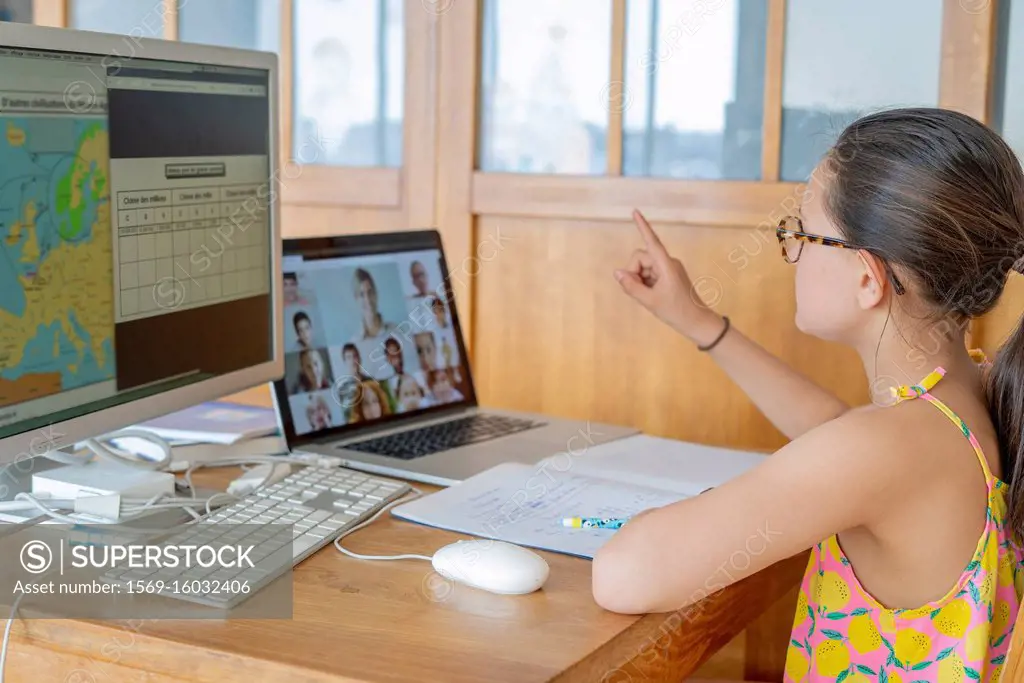 Girl attending online school classes from home