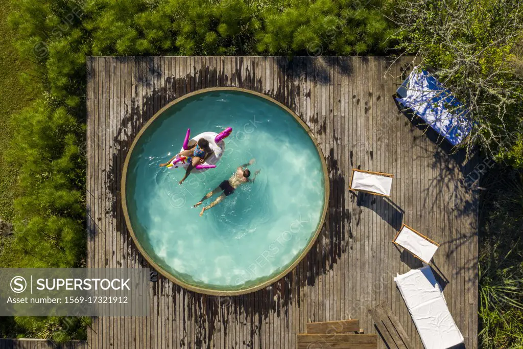 Couple relaxing in swimming pool