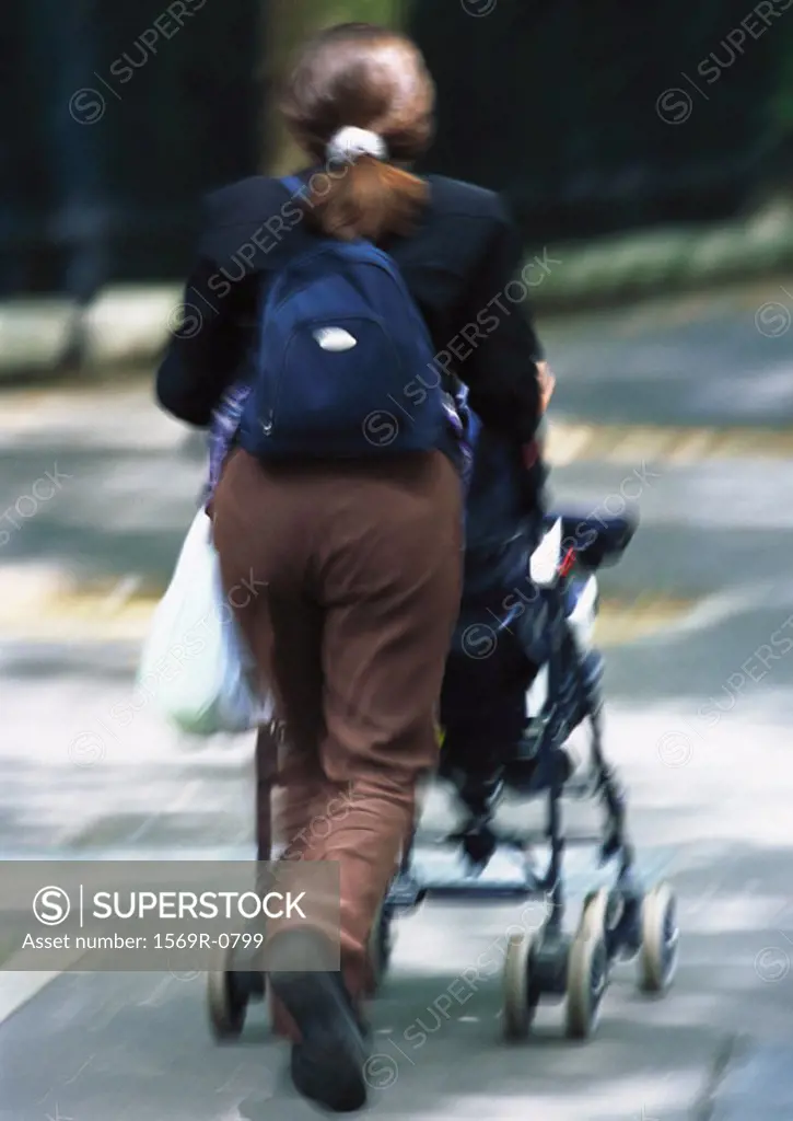 Woman pushing stroller