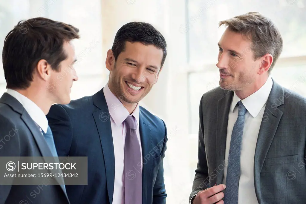 Businessmen having friendly conversation