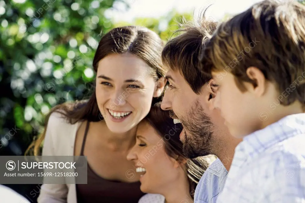 Family laughing together outdoors