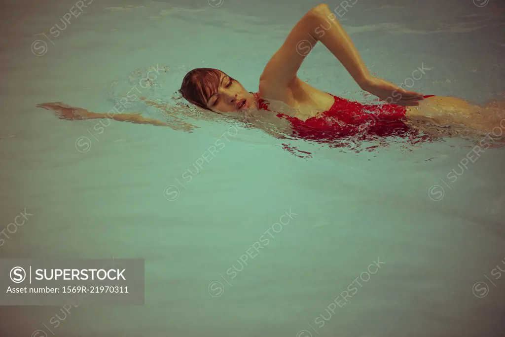 Woman swimming in pool