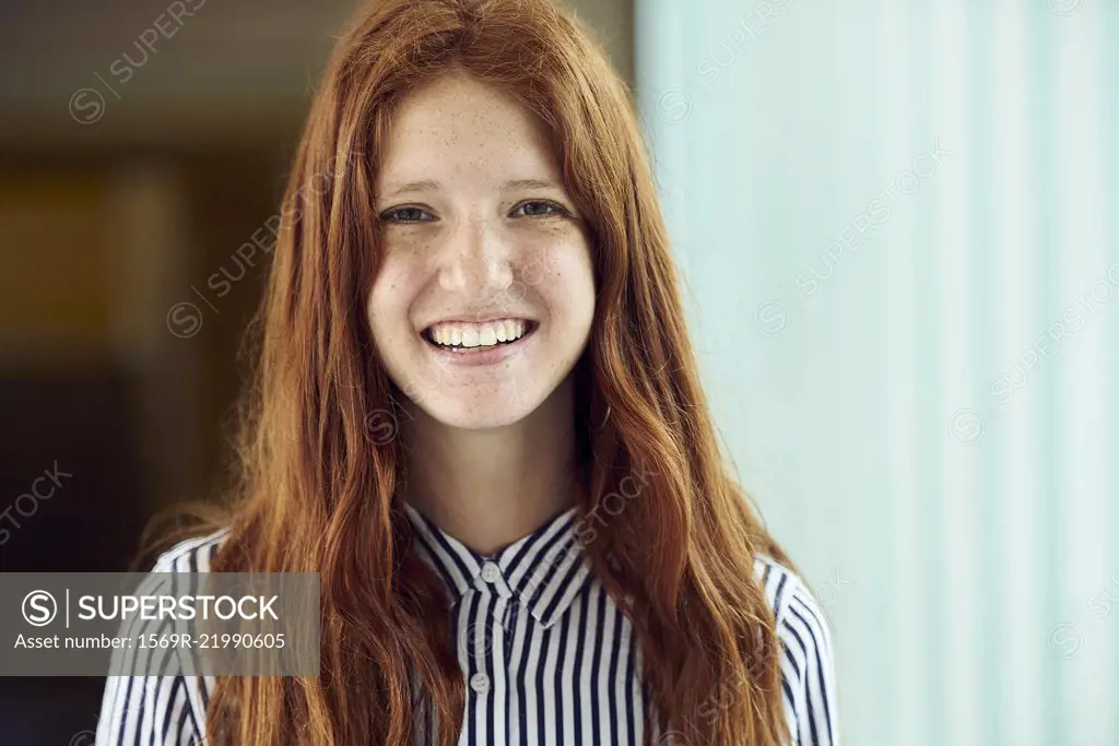 Young woman smiling, portrait