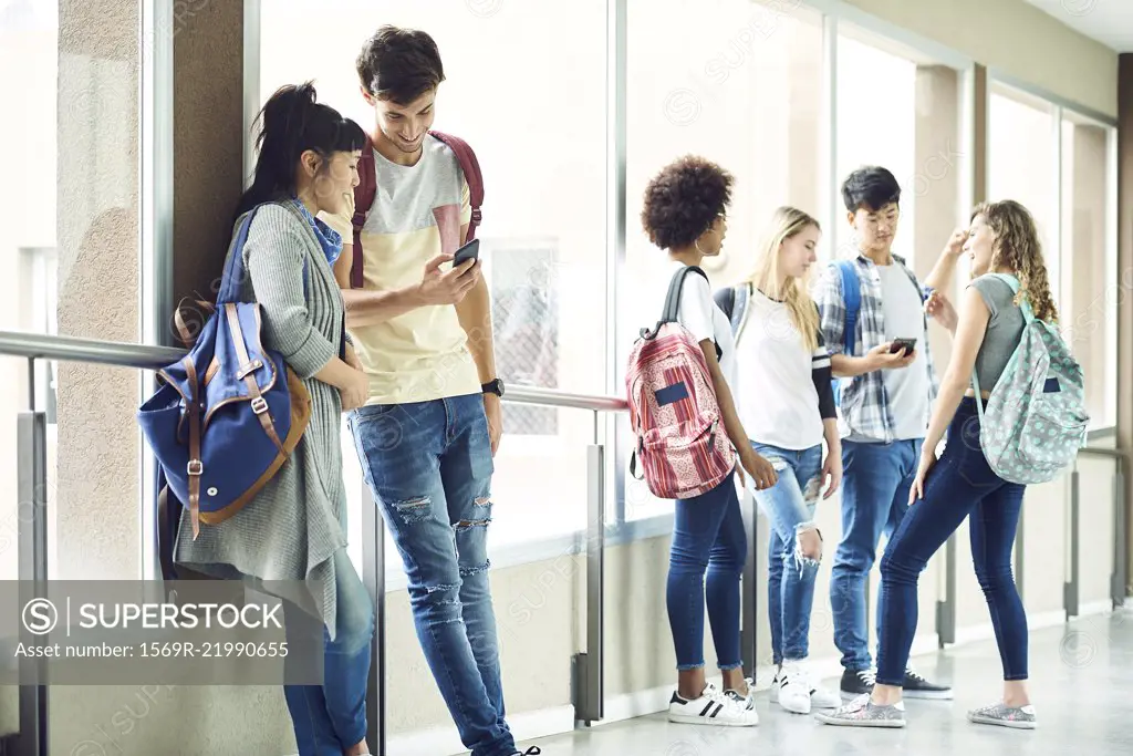 Students hanging out in school corridor between classes