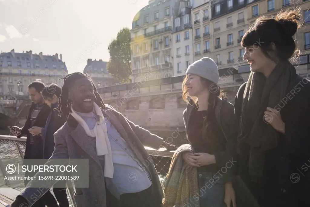 Friends standing together in boat