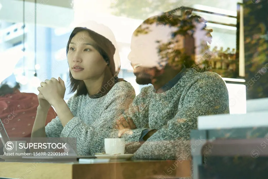 Friends sitting in cafeteria