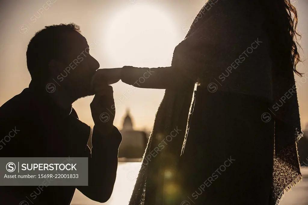 Man proposing to woman near Eiffel Tower