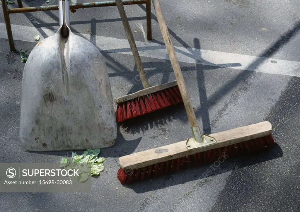 Shovel and brooms outside