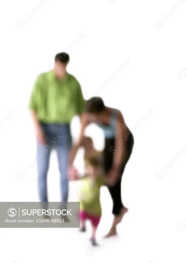 Silhouette of parents with children, on white background, defocused