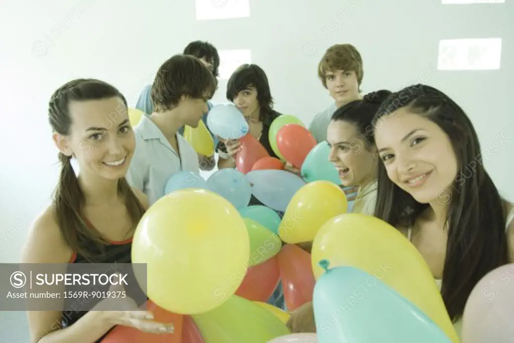 Group of young friends with balloons