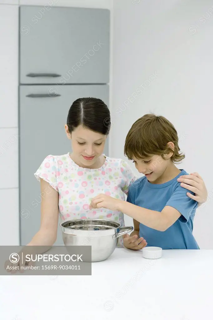 Boy and girl cooking together