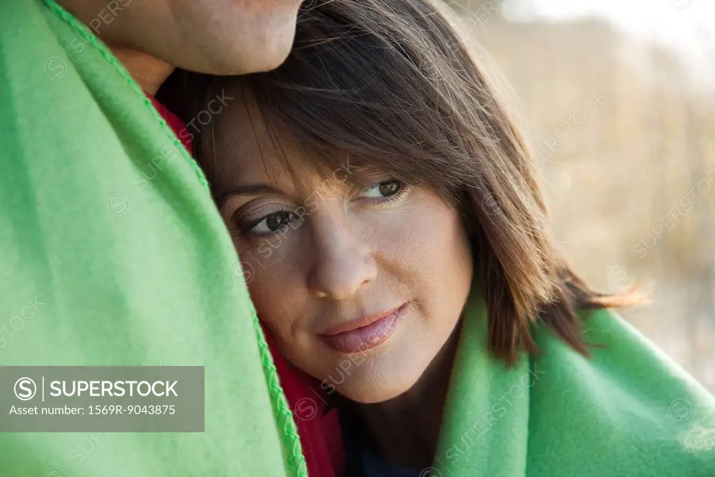 Woman resting head on husband´s chest, portrait