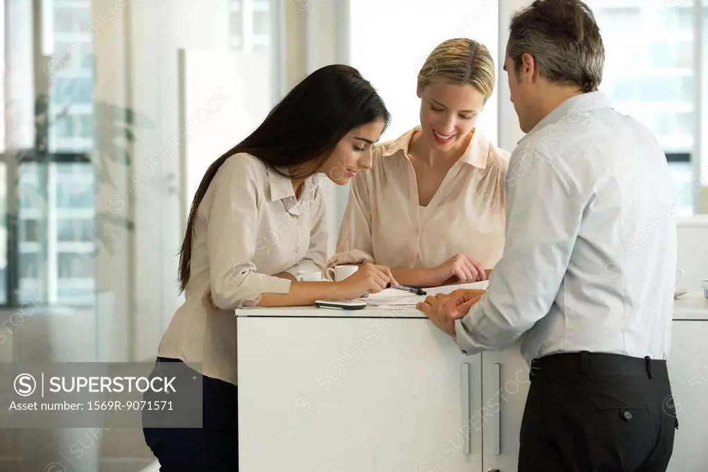 Colleagues working together in office