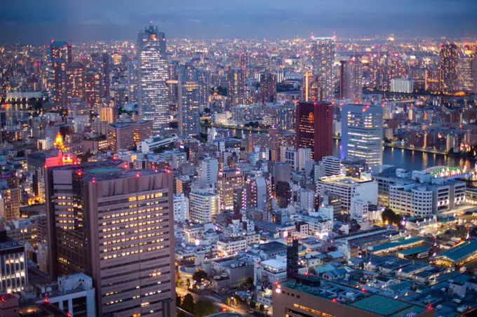 View of crowded cityscape at dusk