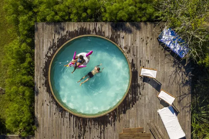 Couple relaxing in swimming pool