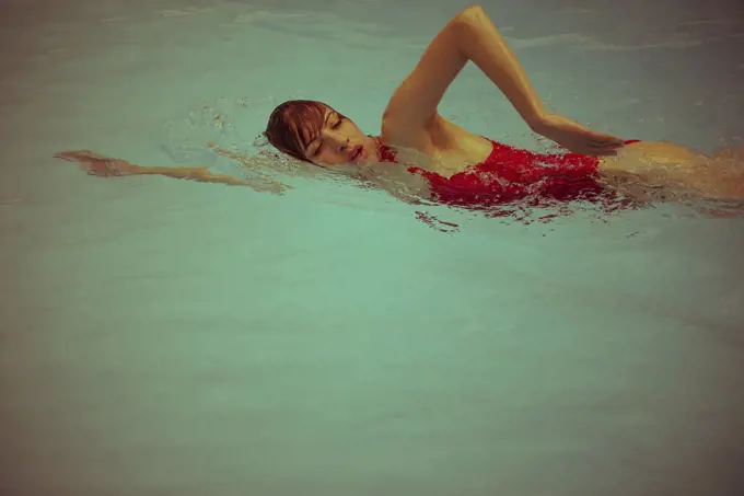 Woman swimming in pool