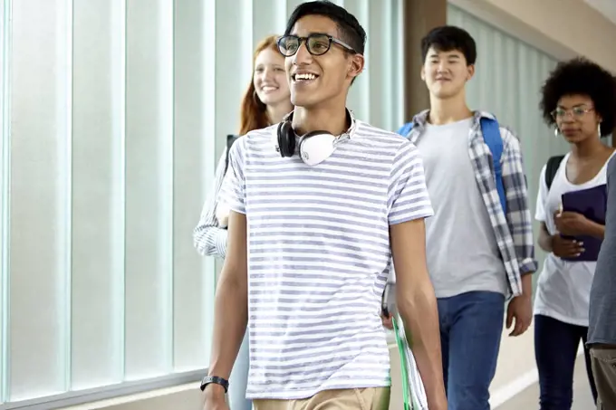 Students walking in school corridor