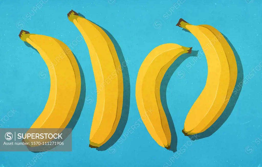 Unpeeled bananas on blue background