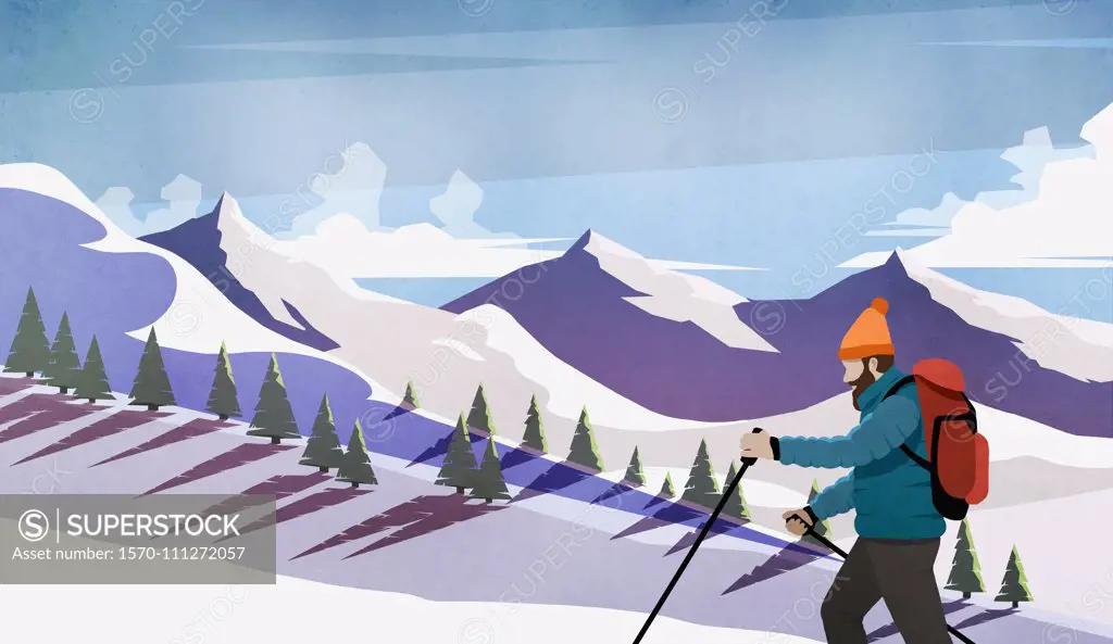 Man cross-country skiing among snowy mountains