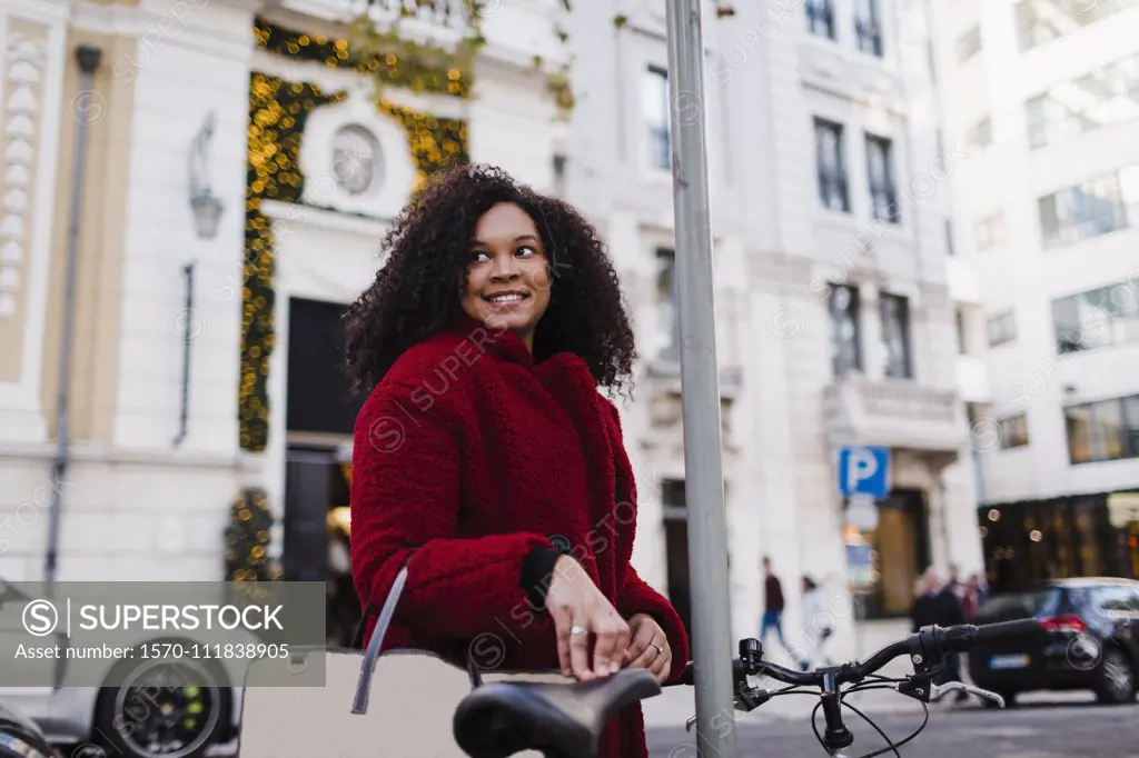 Happy young woman on urban street