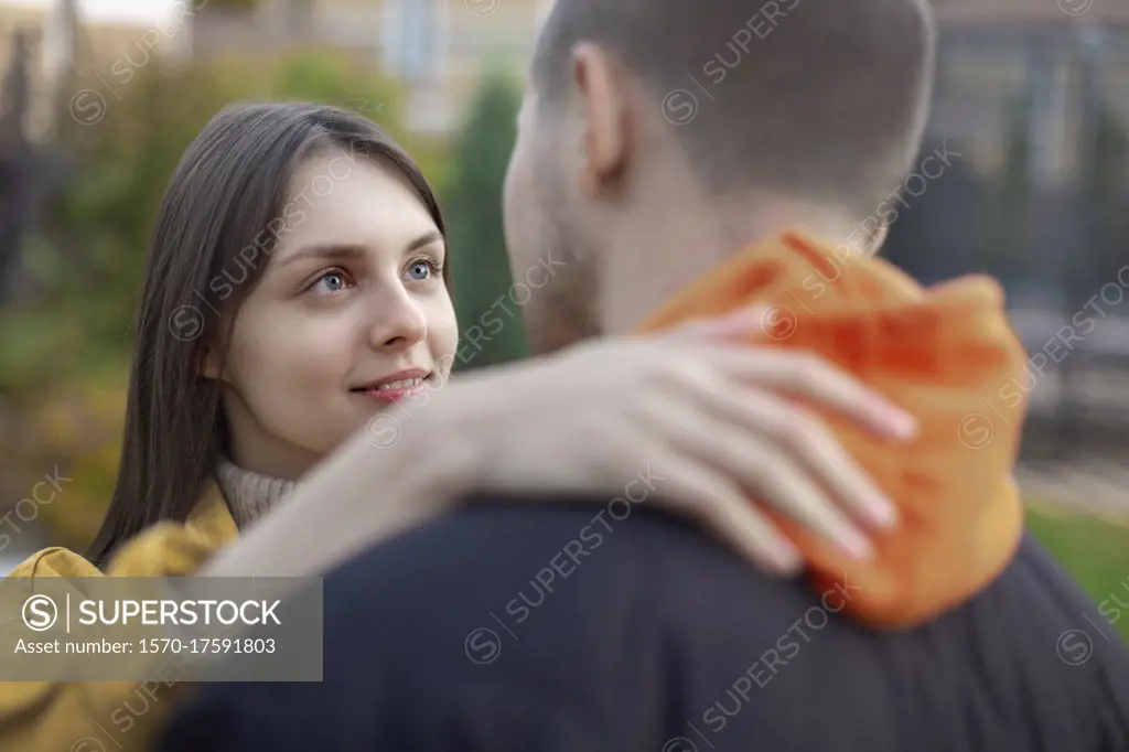 Affectionate young couple hugging