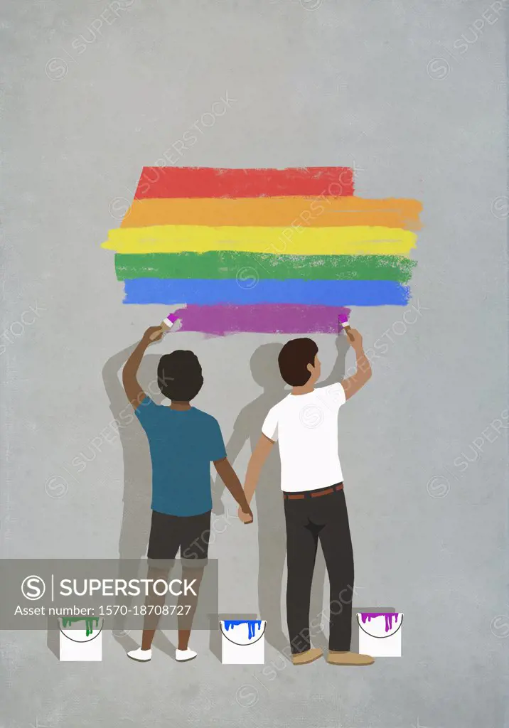 Couple holding hands painting rainbow on wall