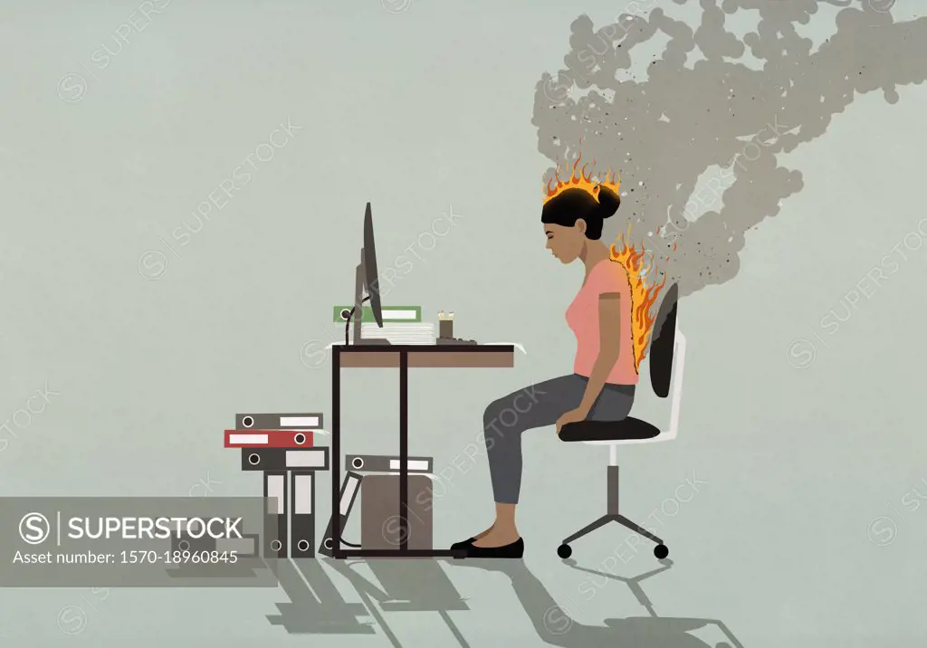 Businesswoman sitting at desk with back and head burning